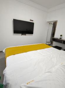 Postel nebo postele na pokoji v ubytování Little Mango Inn