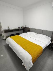 Postel nebo postele na pokoji v ubytování Little Mango Inn