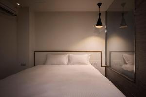 Ein Bett oder Betten in einem Zimmer der Unterkunft Shanmian Unmanned Hotel