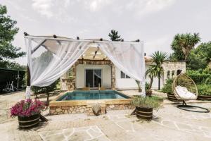 a villa with a swimming pool and a house at Bella Terra Villa Filerimos in Rhodes Town