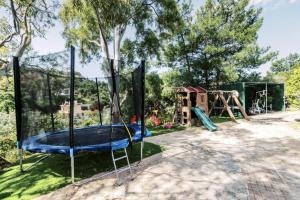 a playground with a trampoline at Bella Terra Villa Filerimos in Rhodes Town