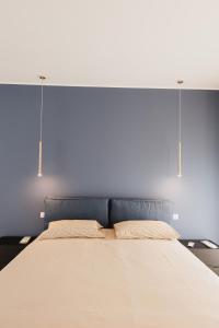 Ένα ή περισσότερα κρεβάτια σε δωμάτιο στο La casa di Libero +8 φωτογραφίες