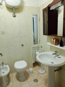 a bathroom with a toilet and a sink at Al Poggetto in Gradoli +24 photos