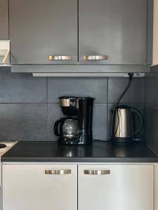 a kitchen with a coffee maker on a counter at One bedroom apartment in Rovaniemi
