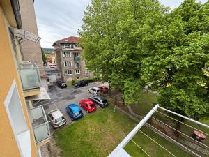 an aerial view of cars parked in a parking lot at apartmán minimal in Spišská Nová Ves
