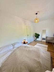 Ένα ή περισσότερα κρεβάτια σε δωμάτιο στο Stilvoll - Designwohnung nahe Westfield Centro