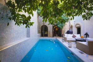 a swimming pool in a house at Riad Kheirredine in Marrakesh