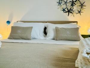 Ένα ή περισσότερα κρεβάτια σε δωμάτιο στο Dimora del Sole Luxury and charm apartment