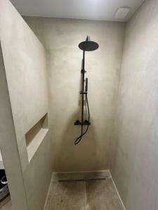 a room with a shelf in the corner of a room at Rez-de-villa 65m2 climatisé in Propriano