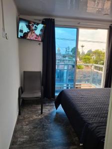 Giường trong phòng chung tại ZIG ZAG Hospedaje