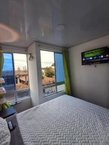 Giường trong phòng chung tại ZIG ZAG Hospedaje