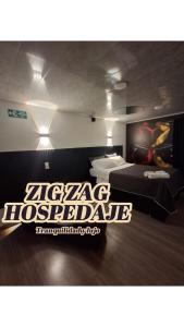 Giường trong phòng chung tại ZIG ZAG Hospedaje