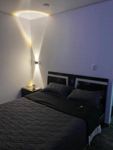 Giường trong phòng chung tại ZIG ZAG Hospedaje
