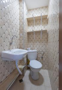 a bathroom with a toilet and a sink at Sea Garden Marina 3 in Varna City
