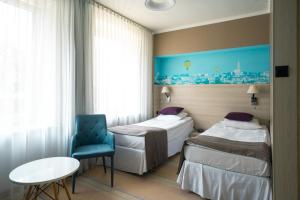 Posteľ alebo postele v izbe v ubytovaní Hotel Cristal Białystok