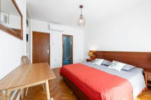 Postel nebo postele na pokoji v ubytování Guest House Međine