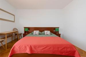 Postel nebo postele na pokoji v ubytování Guest House Međine