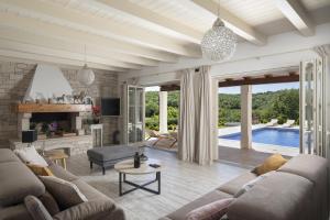 a living room with a couch and a table at Heritage Villa Lilly in Krnica