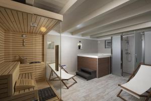 a bathroom with a shower and a sink and a toilet at Heritage Villa Lilly in Krnica