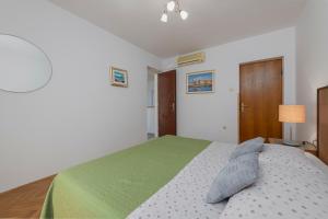 Postel nebo postele na pokoji v ubytování Guest House Međine
