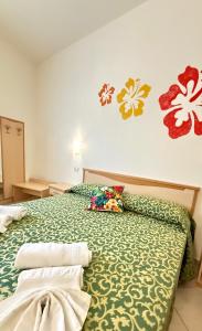 Ένα ή περισσότερα κρεβάτια σε δωμάτιο στο Ibisco Hotel