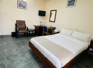 Postel nebo postele na pokoji v ubytování Hotel Barmoi