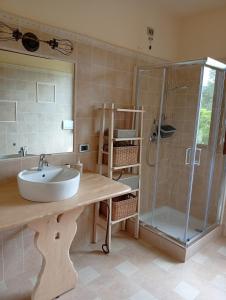 a bathroom with a sink and a shower at Appartamento Oliver2 in Colle di Buggiano +40 photos