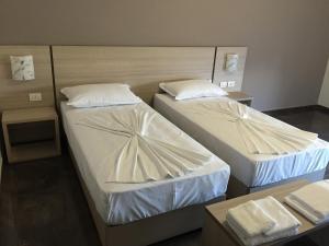 Postel nebo postele na pokoji v ubytování Herges Hotel