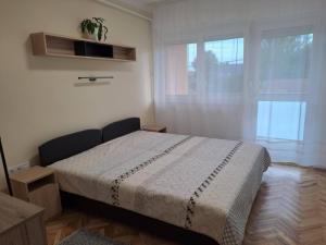 Postel nebo postele na pokoji v ubytování Anna Apartman + 3 fotografie
