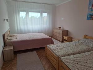 Postel nebo postele na pokoji v ubytování Anna Apartman
