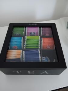 a tablet screen with different colored ties on a shelf at Ninas & Andrejs Gästezimmer in Hinterweiler