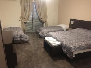 Postel nebo postele na pokoji v ubytování Herges Hotel