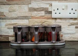 a coffee maker sitting on a counter next to a wall at Villa Modern Two Bedroom Vacation home in Mbezi Beach in Dar es Salaam