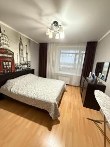 Postel nebo postele na pokoji v ubytování Квартира