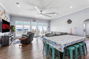 a large living room with a bed and a couch at Blessed 4 Shore Beachfront 4B in Gilchrist