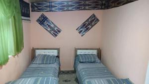 Katil atau katil-katil dalam bilik di Aslon Guest House