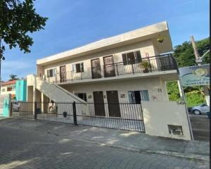 a building with a ramp in front of it at Pousada Central Parque in Penha