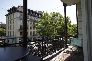 a balcony with a table and chairs and a building at ReLiving - Historic City Apartment in Luzern