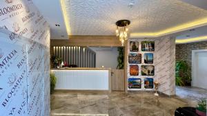 a reception area of a salon with a white counter at Bloomtalya Hotel in Antalya