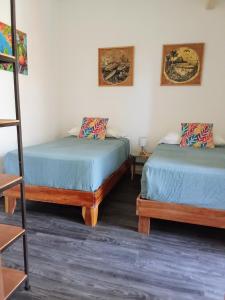 Ένα ή περισσότερα κρεβάτια σε δωμάτιο στο Casa IGUANA