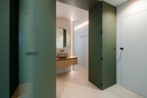 a bathroom with a sink and a mirror at BeComfy - Old town apartment Bratislava in Staré Mesto