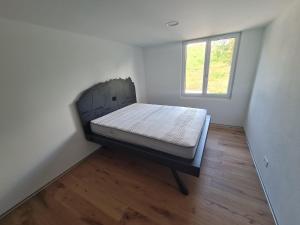 a bedroom with a bed in a room with a window at Exclusive luxury rental apartment in Oberems +13 photos