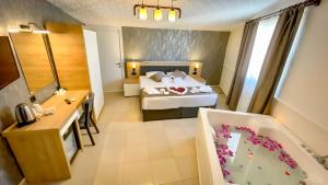 a hotel room with a bed and a bathroom at Bloomtalya Hotel in Antalya +84 photos