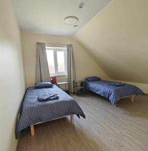 Postel nebo postele na pokoji v ubytování Meierei kohviku majutus
