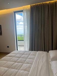 Postel nebo postele na pokoji v ubytování Skanderbeg Hotel