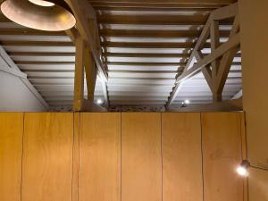a room with wooden cabinets and a ceiling at the Workshop in Plomari