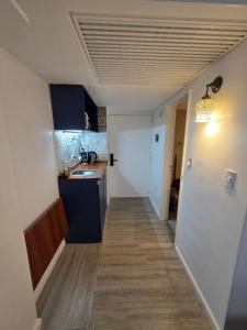 a kitchen with a sink and a counter top at Infinit Point Apartment in Buenos Aires