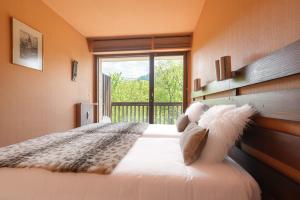 Giường trong phòng chung tại Appartement Cornec - Your stay in Megève