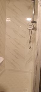 a bathroom with a shower with a glass door at l'HYPERCENTRE in Clermont-Ferrand +46 photos