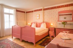 Ένα ή περισσότερα κρεβάτια σε δωμάτιο στο Historic Hotel Falken